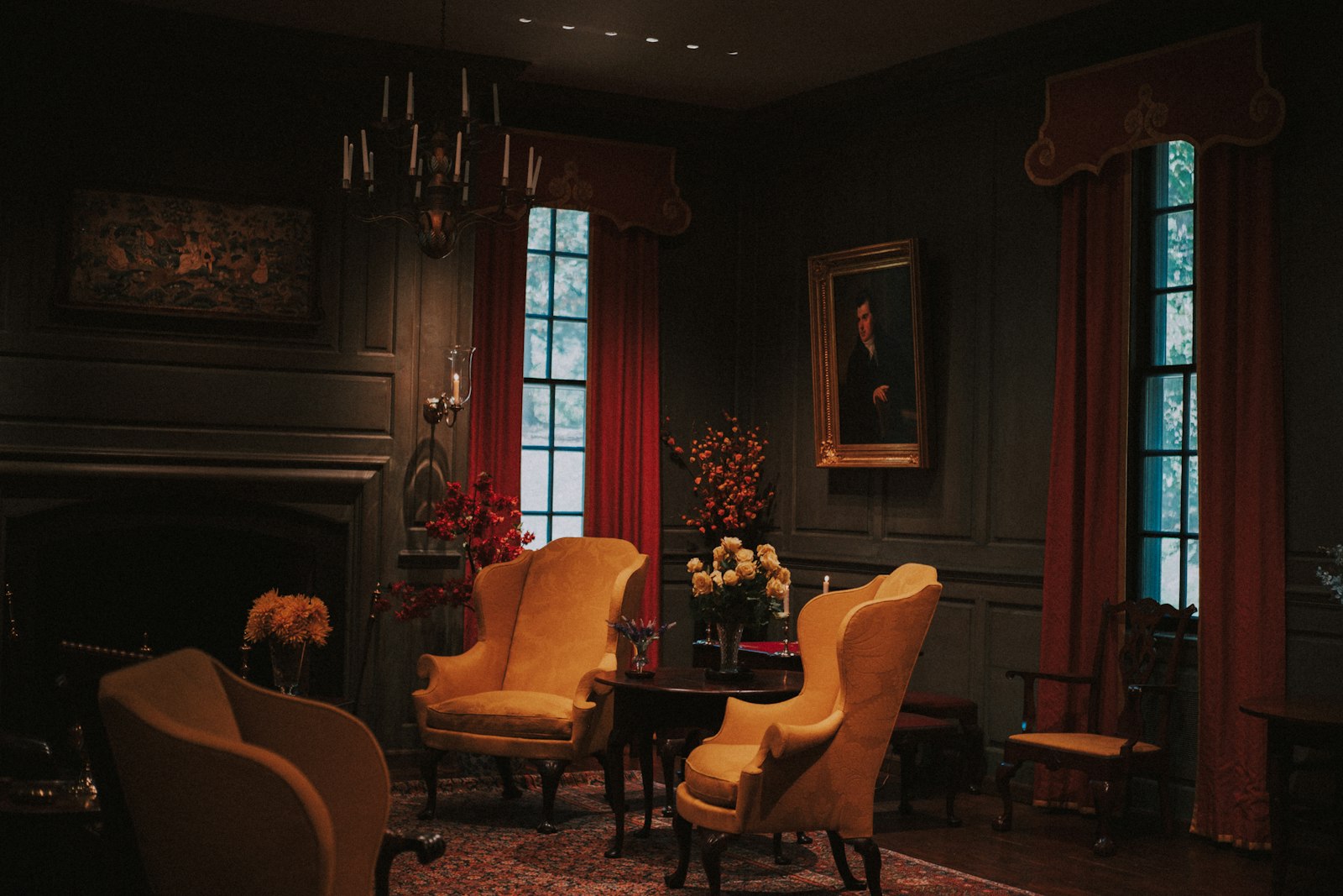 The morning room, wing chairs drawn up to the fire