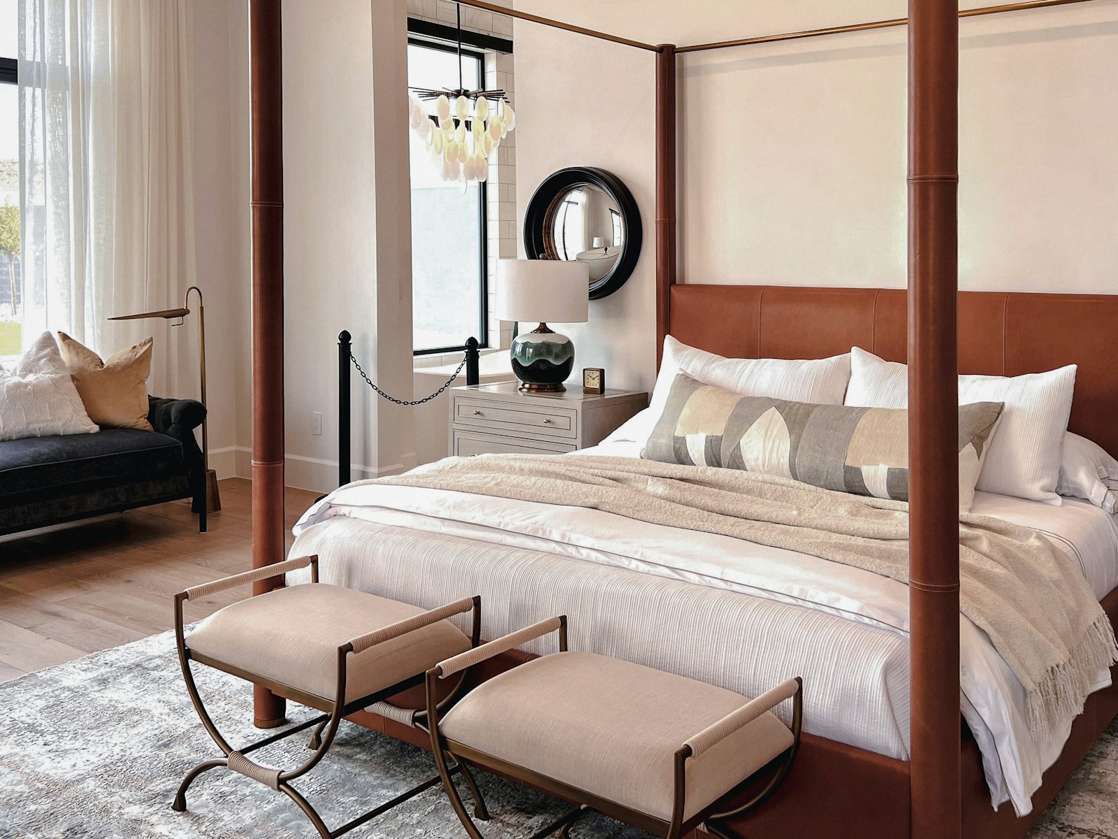 The Ffrwd Suite bedroom, four-poster bed and a chaise by the window